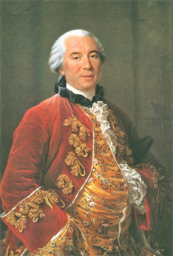 Portrait peint d'un homme d'une quarantaine d'années, perruque poudrée blanche, en habit rouge brodé d'or, la main sur la poitrine.